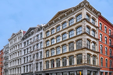 Fototapeta na wymiar Historic cast iron buildings, used as loft apartments and shops, Broome Street in SoHo area of Manhattan