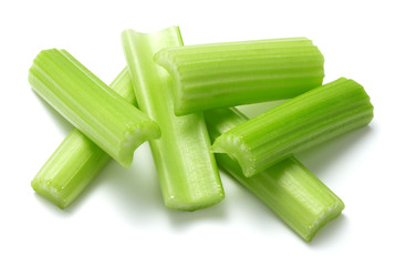 heap of chopped celery stems isolated on white background