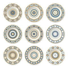 Set of decorative plates with a circular blue pattern, top view. White background. Vector illustration.