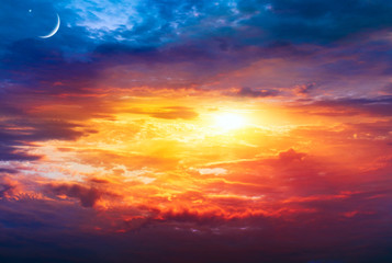 Crescent moon with beautiful sunset background . Generous Ramadan . Light from sky . Religion background .  