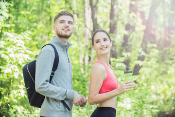 young couple of runners at Forest Environments, wandering in forests