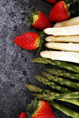 White and green asparagus with strawberries