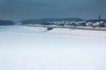 Fototapeta na wymiar Winter landscape with bridge and road