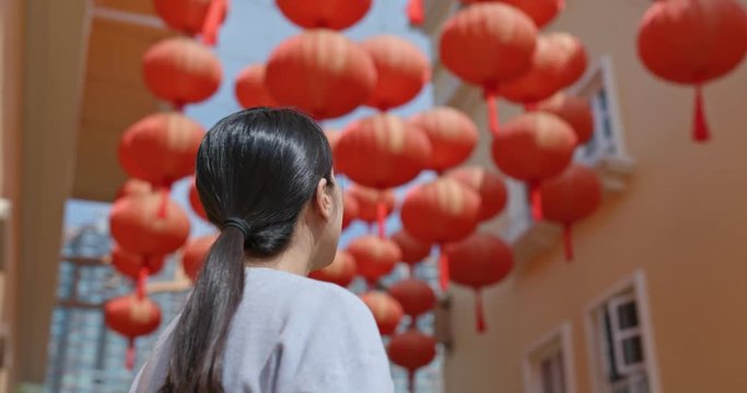Woman look at the red lantern for chinese new year