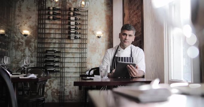 Portrait of male chef in restaurant