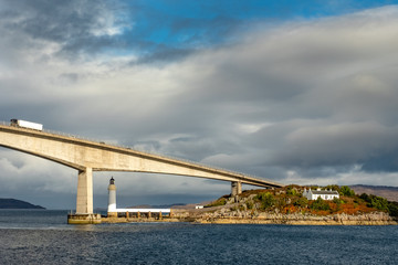 Obraz premium Lighthouse under the tall bridge, Scotland, UK