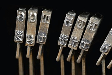 Typewriter background. Traditional typewriter letterpress arms. Old, rusty antique vintage typewriter