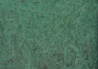 Recycled compressed green painted  wood chipboard. Pressed Wooden Panel (OSB).