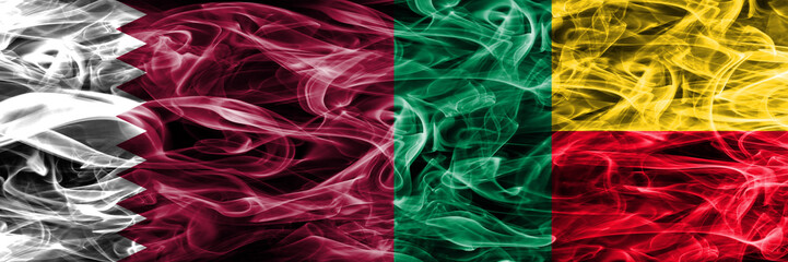 Obraz premium Qatar vs Benin, Beninese smoke flags placed side by side. United Arab Emirates. UAE.