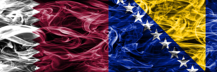 Obraz premium Qatar vs Bosnia and Herzegovina, Bosnian smoke flags placed side by side. United Arab Emirates. UAE.