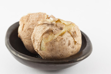 Traditional Colombian cooked potatoes called papas saladas isolated on white background