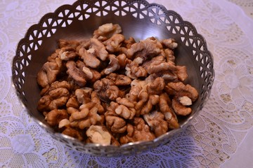 Walnuts peeled in a vase on the table