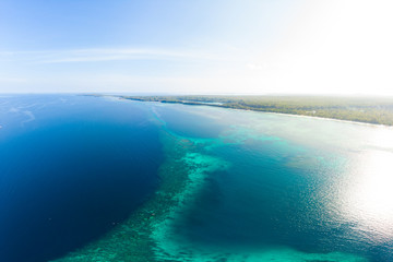 Aerial view coral reef scattered in caribbean sea, tropical beach islands. Indonesia Moluccas archipelago, Kei Islands, Banda Sea. Top travel destination, best diving snorkeling, stunning panorama.