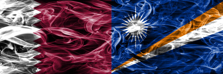 Obraz premium Qatar vs Marshall Islands smoke flags placed side by side. United Arab Emirates. UAE.