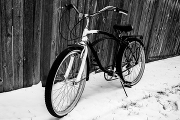 Fototapeta na wymiar Vintage bicycle on Winter Snow - Black & White V