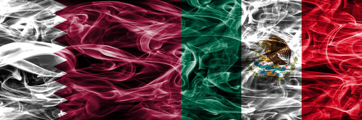 Obraz premium Qatar vs Mexico, Mexican smoke flags placed side by side. United Arab Emirates. UAE.