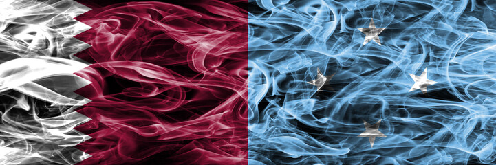 Obraz premium Qatar vs Micronesia, Micronesian smoke flags placed side by side. United Arab Emirates. UAE.