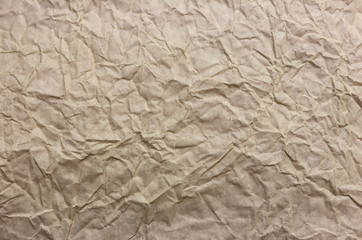 background. crumpled beige / gray paper