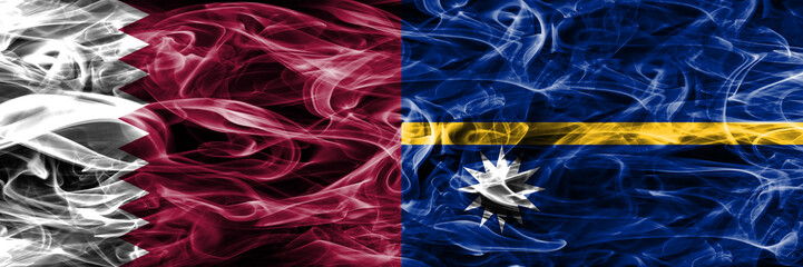 Obraz premium Qatar vs Nauru smoke flags placed side by side. United Arab Emirates. UAE.
