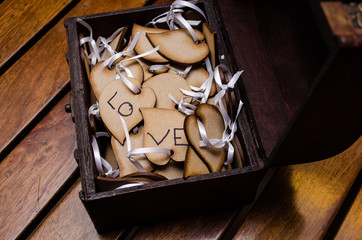 word love on a wooden flower petals on a beautiful natural wooden table