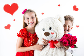 Pretty little girl and boy  celebrating Saint Valentine's Day and holding red roses bucket  and white bear gift on the white background with red hearts