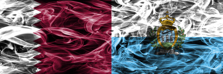 Obraz premium Qatar vs San Marino, Sammarinese smoke flags placed side by side. United Arab Emirates. UAE.