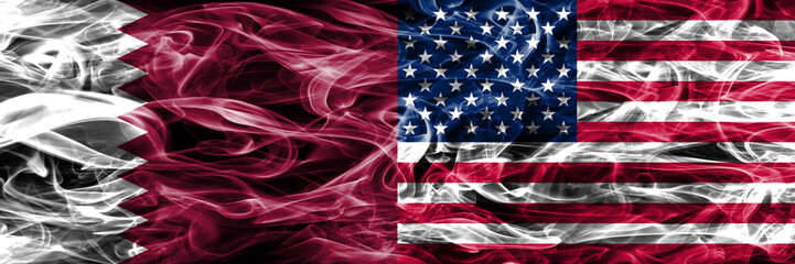 Qatar vs United States of America, American smoke flags placed side by side. United Arab Emirates. UAE.