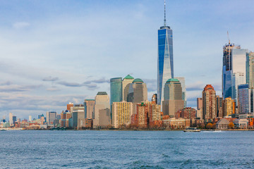 Buildings and skyscrapers of downtown Manhattan over water, in New York City, USA