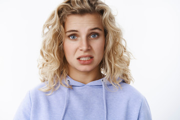 Girl feels sorry and upset expressing empathy, looking concerned with sorrow in eyes apologizing...