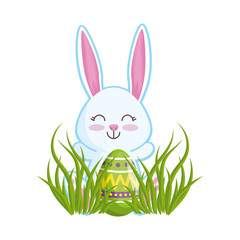 cute rabbit with easter egg painted in the meadow