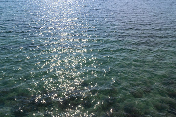Sea surface and wave moving to the beach, reflected blue sky color in the evening in Koh Mak Island at Trat, Thailand.