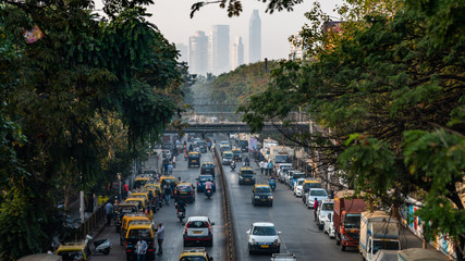 view from a bridge of a traffic city of bombay during a day