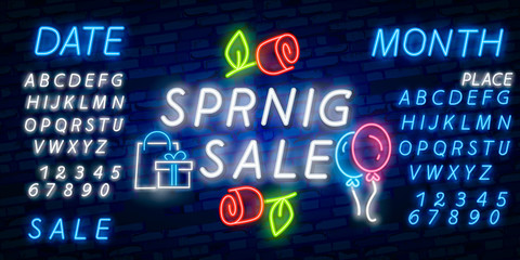 Neon alphabet and Happy Spring lettering in flower frame over brick background. Spring sale, seasonal goods, store emblem. Spring concept. For signboards, template design, banners