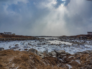 ice on frozen lake with rocks