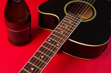 Obraz na płótnie Canvas Acoustic guitar on red background