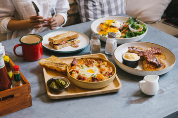 Eggs Benedict, Crispy Bacon stuffed French toast, Cheesy Potato with Crispy Bacon and Pancakes with Maple Syrup, Bacon and Vanilla Ice Cream. Served with Hot Latte.