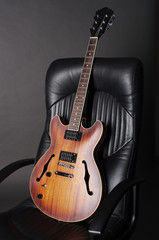 Electric guitar on a black chair