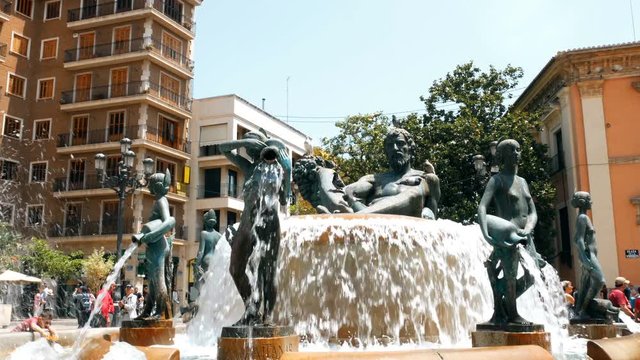 Valencia Piazza Fontana, view of the Turia fountain in the Plaza de la Virgen in the center of the old town of Valencia, Spain.