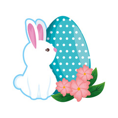 cute rabbit with easter egg painted in the garden