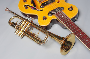 Fototapeta na wymiar Trumpet and electric guitar. Musical instruments