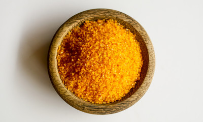 Yellow corn grits on white background. 