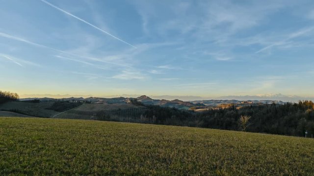 Panoramic view of a sunset on the Alps from a hill in the Montferrat