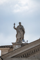 Fototapeta na wymiar Statue of apostle on Dome of St. Peter's Basilica in Vatican City, Italy