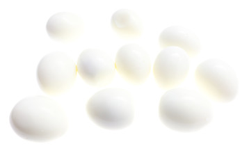 Peeled boiled eggs on a white background