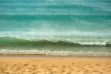 Azure wave on the beach