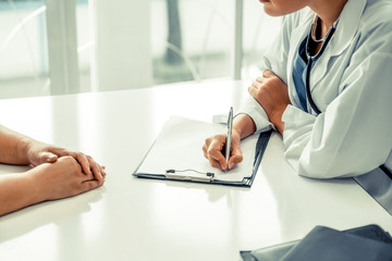 Female patient visits woman doctor or gynecologist during gynaecology check up in office at the...