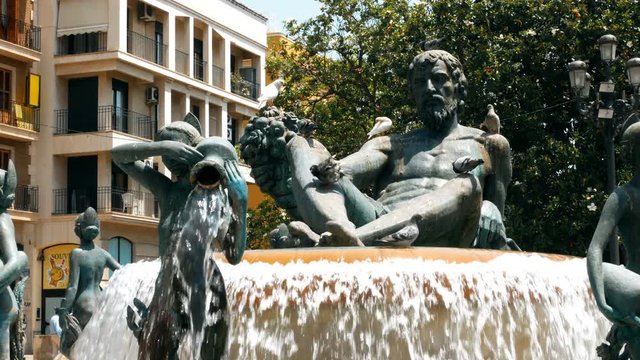 Valencia Piazza Fontana, view of the Turia fountain in the Plaza de la Virgen in the center of the old town of Valencia, Spain.