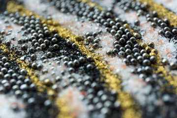 Layered blur sand pattern. Marble style background. Black and gold powder defocused texture.