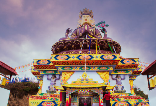 Monk offering his prayers outside a Buddhist Temple 