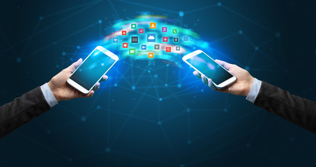 Two mobile phones syncing applications concept